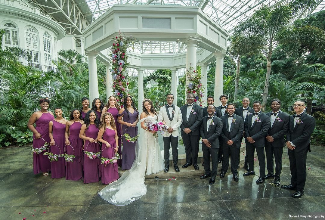Late spring wedding floral design at Gaylord Opryland featuring garden roses and lush greenery in a bright berry tone color palette.