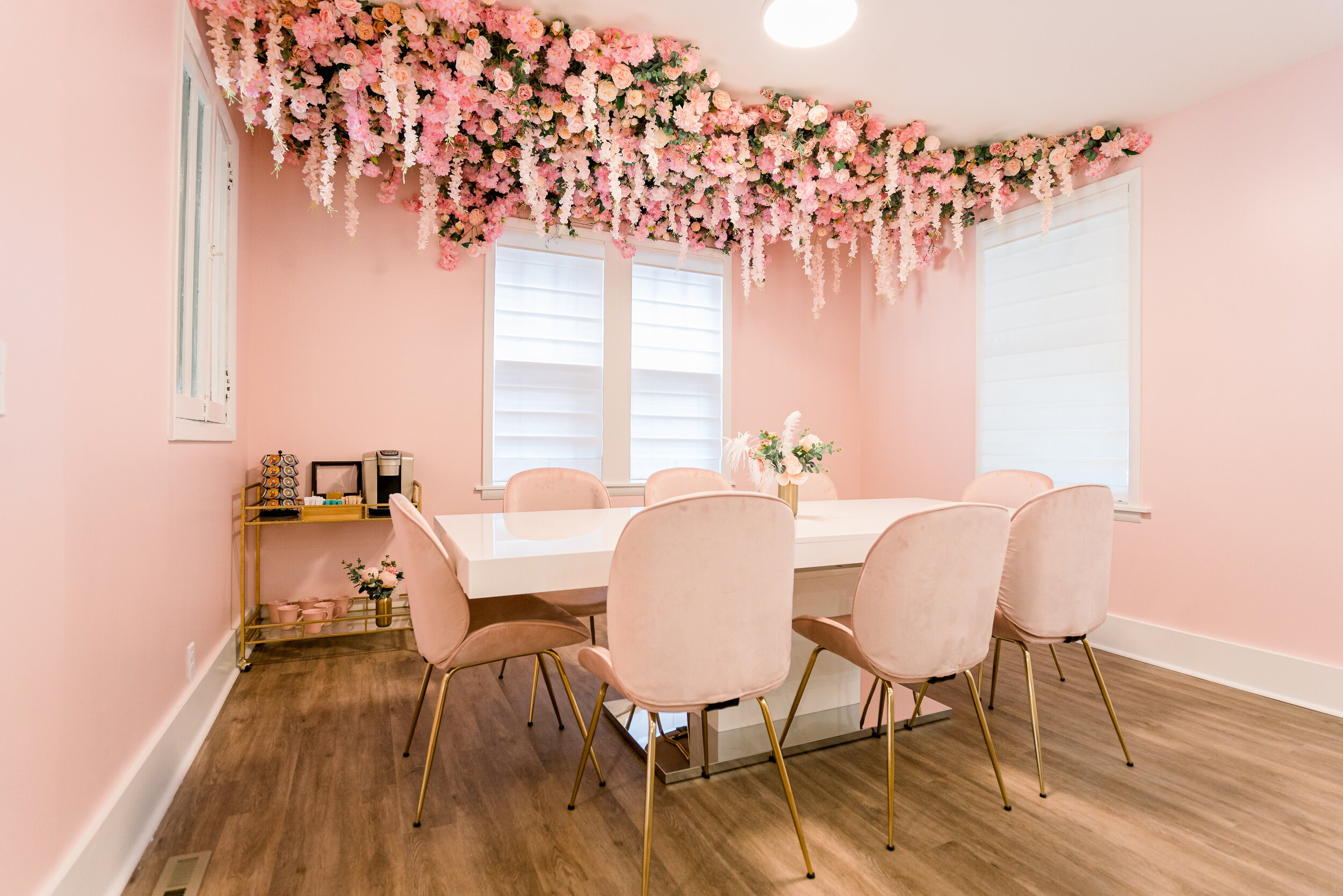 This bachelorette airbnb has a semi permanent ceiling installation full of faux cherry blossom, blush dahlias, pink roses, hanging wisteria, and spanish moss. Designed by florist Rosemary & Finch in Nashville, TN..jpg