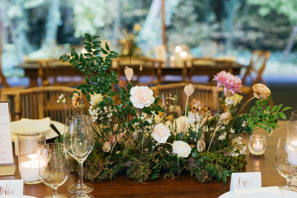 Autumnal wedding floral design at RT Lodge featuring ranunculus, garden roses, and dried flowers in a neutral fall color palette.