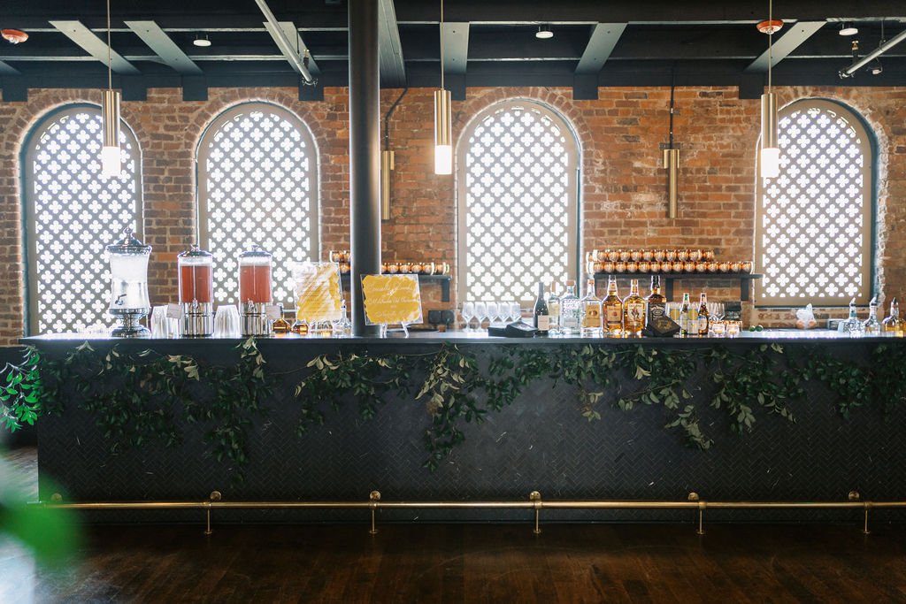 Elegant growing smilax installations adorned the cocktail lounge, enhancing the natural atmosphere. Designed by Rosemary and Finch in Nashville, TN.