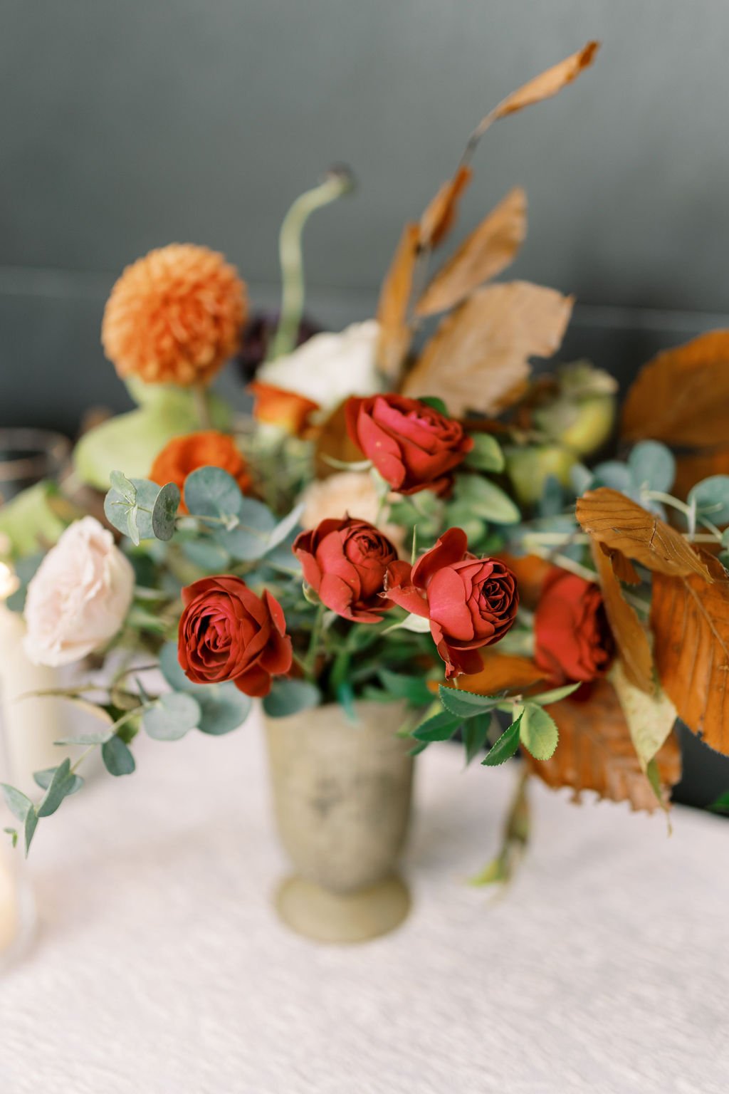 A sweet entrance table arrangement with garden roses, ranunculus, dahlias and greenery. Floral Design by Rosemary and Finch in Nashville, TN.