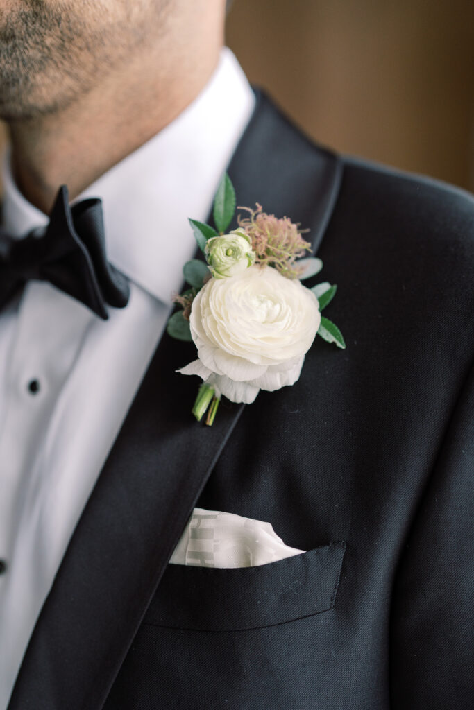 Classic white boutonniere for summer wedding in Tennessee. Cream, white, and green floral colors create a timeless look for this wedding in downtown Nashville. Design by Rosemary & Finch Floral Design in Nashville, TN. 