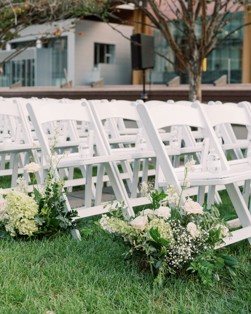 Garden-inspired floral aisle markers for summer wedding. Classic white and green wedding with timeless garden-inspired floral design. Ceremony aisle florals for summer wedding in downtown Nashville. Design by Rosemary & Finch Floral Design in Nashville, TN. 