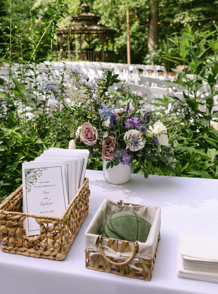 Whimsical spring wedding in Tennessee countryside with flower colors in lavender, purple, cream, mauve, and natural green. Garden-inspired floral design consisting of roses, delphinium, thistle, and natural greenery. Design by Rosemary & Finch Floral Design in Nashville, TN.