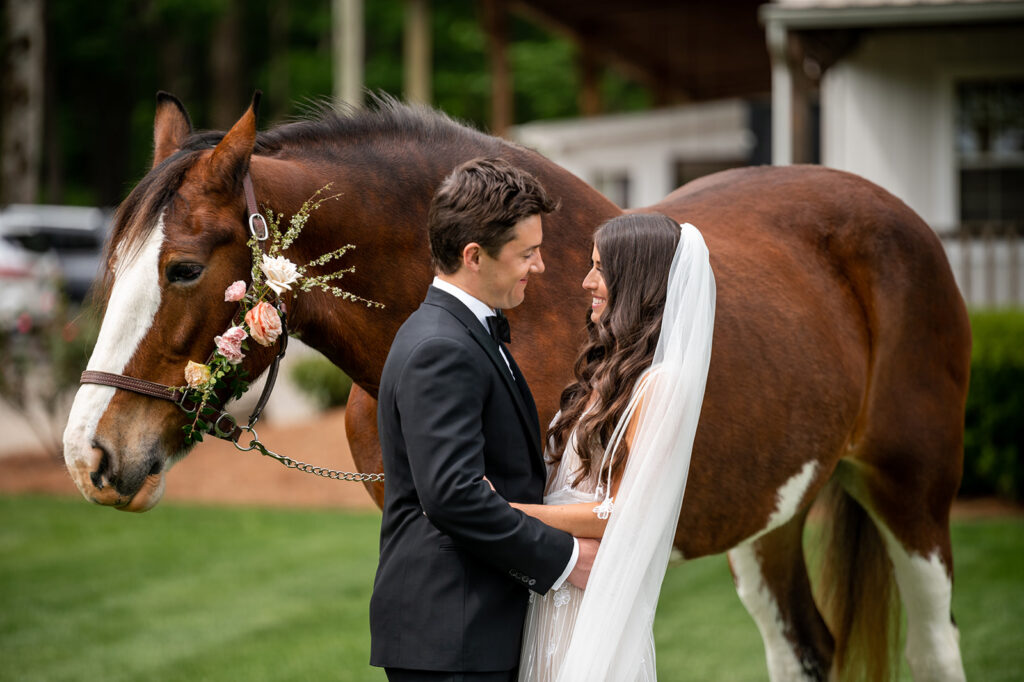 Dainty florals for horse in spring countryside wedding outside of Nashville, TN. Pink florals were the highlight of this vibrant spring wedding. Design by Rosemary & Finch Floral Design in Nashville, TN. 