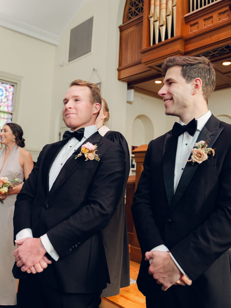 Unique fall floral boutonniere for groom and groomsmen in dusty rose, copper, tangerine, honey, and caramel flower colors. Ranunculus and wildflower fall boutonniere. Destination wedding in Tennessee countryside. Floral design by Rosemary & Finch Floral Design in Nashville, TN.