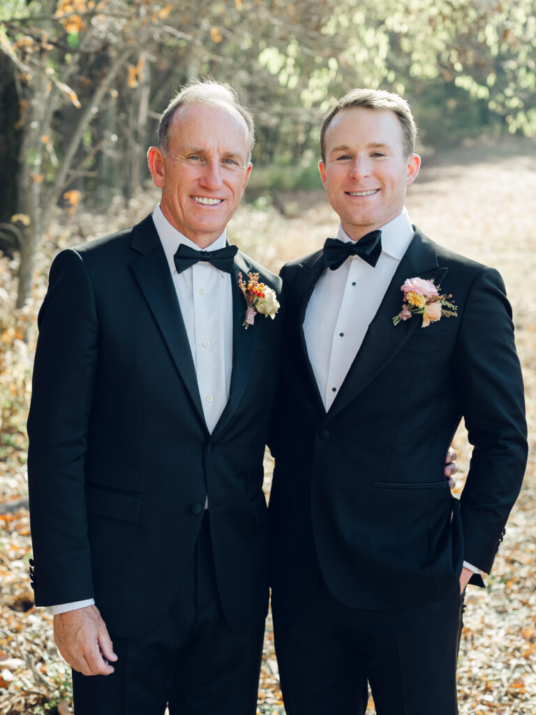 Unique fall floral boutonniere for groom and groomsmen in dusty rose, copper, tangerine, honey, and caramel flower colors. Ranunculus and wildflower fall boutonniere. Destination wedding in Tennessee countryside. Floral design by Rosemary & Finch Floral Design in Nashville, TN.