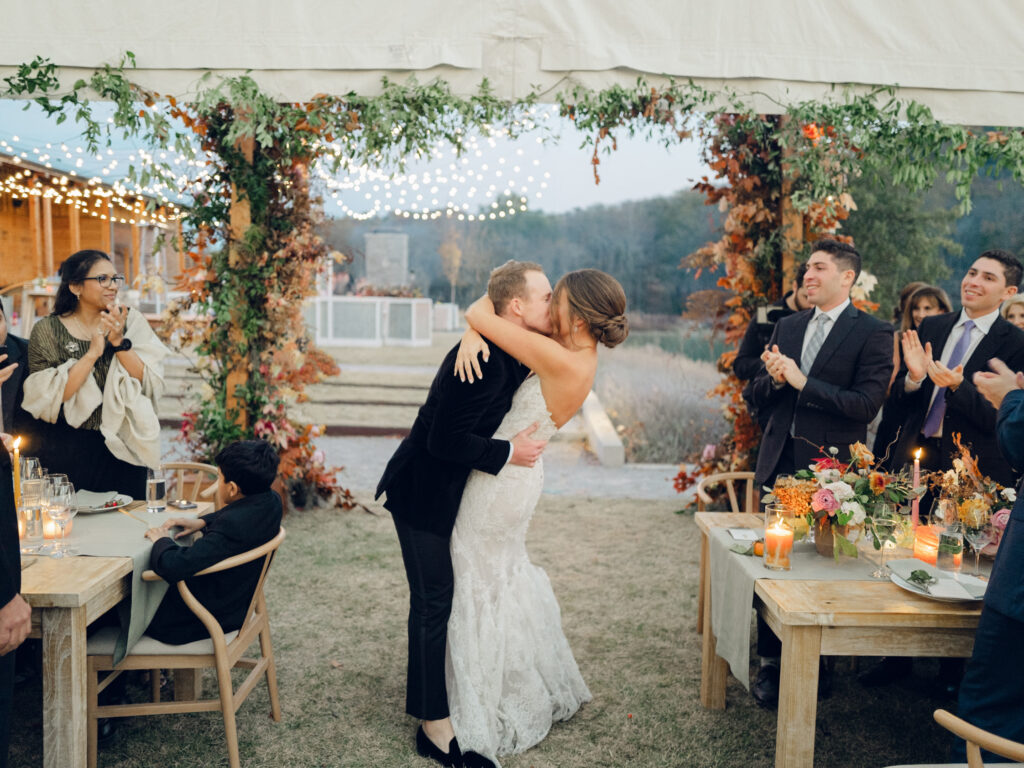 Unique and classic fall wedding in Tennessee countryside. Wedding colors of caramel, honey, dusty rose, and burgundy make perfect fall wedding florals. Roses, ranunculus, wildflowers, and fall foliage invite warm tones for outdoor fall wedding outside Nashville, TN. Design by Rosemary & Finch Floral Design in Nashville, TN. 