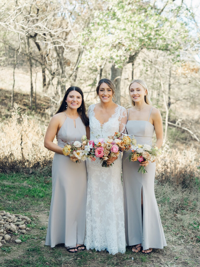 Whimsical bridal bouquet in unique fall tones caramel, dusty rose, peach, tangerine, and copper. Fall floral bouquet with roses, ranunculus, mums, fruiting branches, and clematis. Medium sized bridal bouquet with fall colors. Destination wedding outside Nashville, TN. Design by Rosemary & Finch Floral Design in Nashville, TN. 