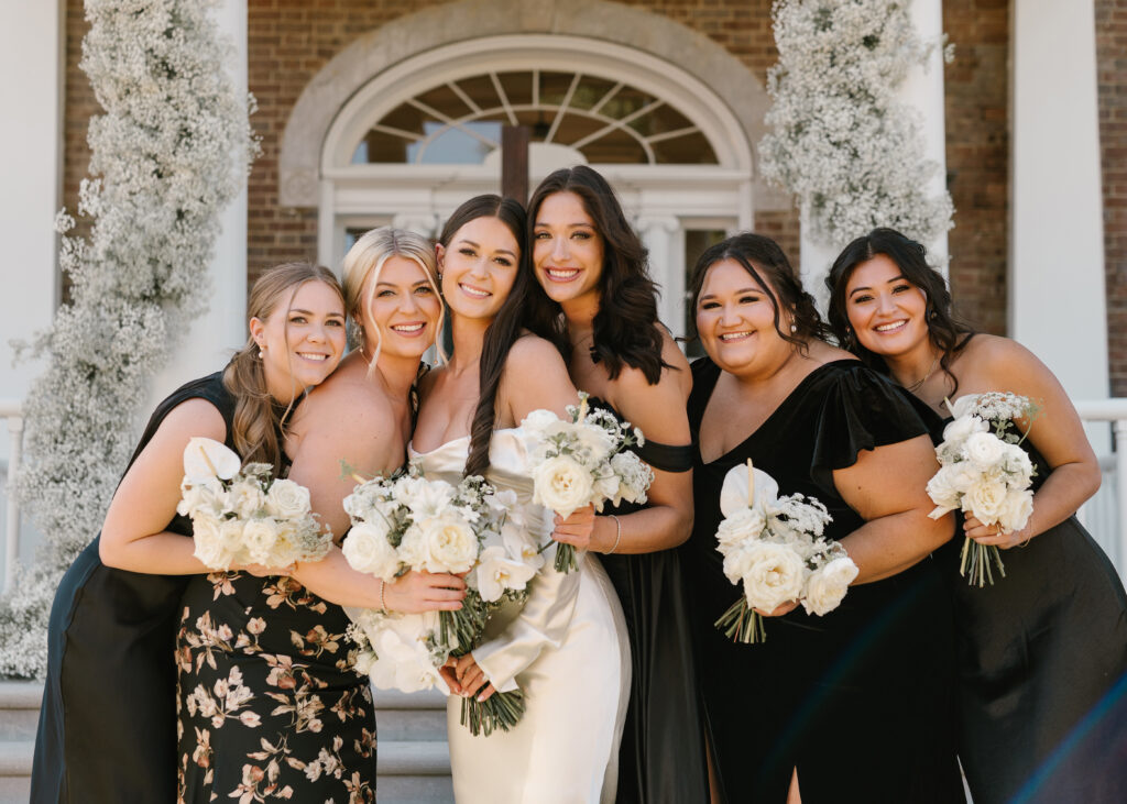 Modern bridal bouquet and bridesmaids’ bouquets with all white florals. Classic bridal bouquet with babies’ breath, roses, and orchids. Modern twist on fall wedding with white, taupe, and black color scheme. Fall private estate wedding in Tennessee. Design by Rosemary & Finch Floral Design. 