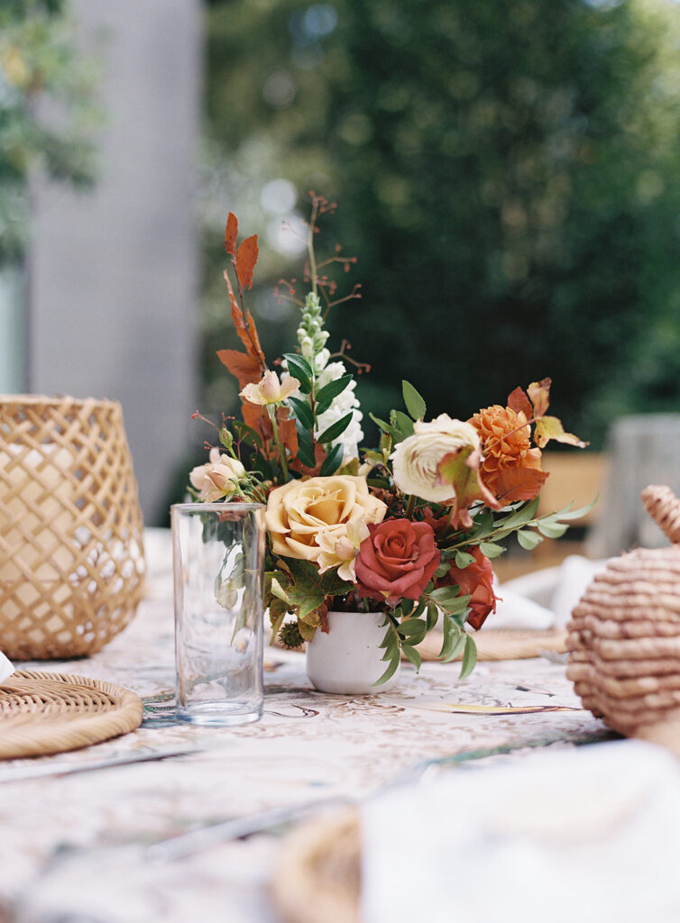 Bridesmaids luncheon florals for fall wedding. Fall floral colors in rust, burgundy, sage, cream, and copper. Charming outdoor dinner party for fall wedding. Accent centerpieces in ceramic vases decorate fall wedding bridal shower in Nashville, Tennessee. Design by Rosemary & Finch Floral Design in Nashville, TN. 