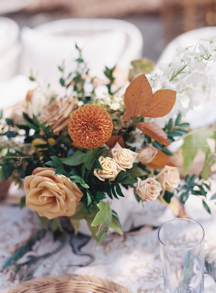 Bridesmaids luncheon florals for fall wedding. Fall floral colors in rust, burgundy, sage, cream, and copper. Charming outdoor dinner party for fall wedding. Accent centerpieces in ceramic vases decorate fall wedding bridal shower in Nashville, Tennessee. Design by Rosemary & Finch Floral Design in Nashville, TN. 