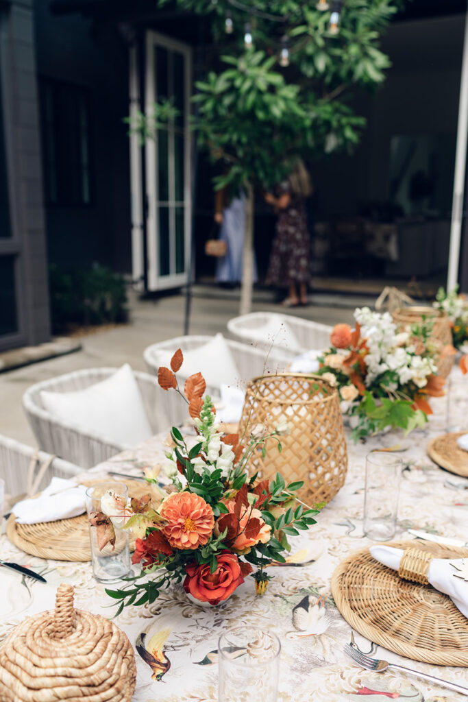 Bridesmaids luncheon florals for fall wedding. Fall floral colors in rust, burgundy, sage, cream, and copper. Charming outdoor dinner party for fall wedding. Accent centerpieces in ceramic vases decorate fall wedding bridal shower in Nashville, Tennessee. Design by Rosemary & Finch Floral Design in Nashville, TN. 