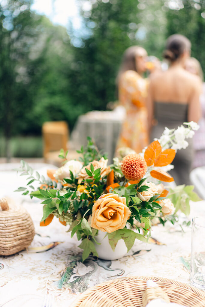 Bridesmaids luncheon florals for fall wedding. Fall floral colors in rust, burgundy, sage, cream, and copper. Charming outdoor dinner party for fall wedding. Accent centerpieces in ceramic vases decorate fall wedding bridal shower in Nashville, Tennessee. Design by Rosemary & Finch Floral Design in Nashville, TN. 