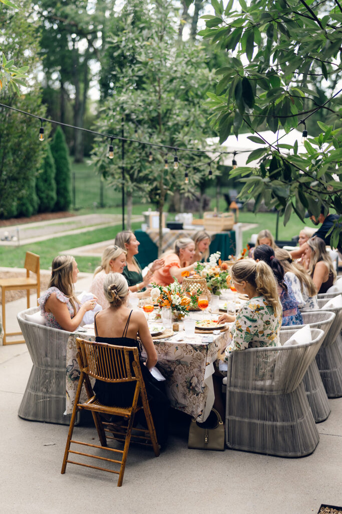 Bridesmaids luncheon florals for fall wedding. Fall floral colors in rust, burgundy, sage, cream, and copper. Charming outdoor dinner party for fall wedding. Accent centerpieces in ceramic vases decorate fall wedding bridal shower in Nashville, Tennessee. Design by Rosemary & Finch Floral Design in Nashville, TN. 