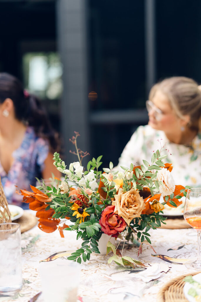 Bridesmaids luncheon florals for fall wedding. Fall floral colors in rust, burgundy, sage, cream, and copper. Charming outdoor dinner party for fall wedding. Accent centerpieces in ceramic vases decorate fall wedding bridal shower in Nashville, Tennessee. Design by Rosemary & Finch Floral Design in Nashville, TN. 