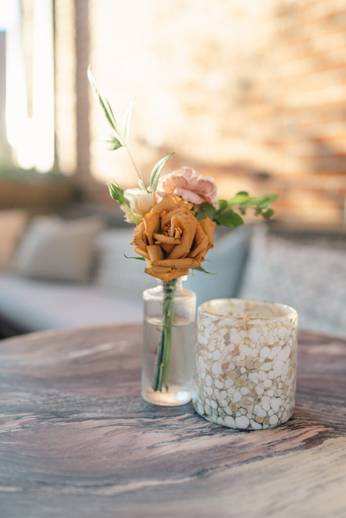 Wedding welcome party florals for fall wedding. Fall floral colors in rust, burgundy, sage, cream, and copper. Charming boho style party at Soho House Nashville. Accent centerpieces in ceramic vessels and glass bud vases decorate fall wedding welcome party in Nashville, Tennessee. Design by Rosemary & Finch Floral Design in Nashville, TN. 