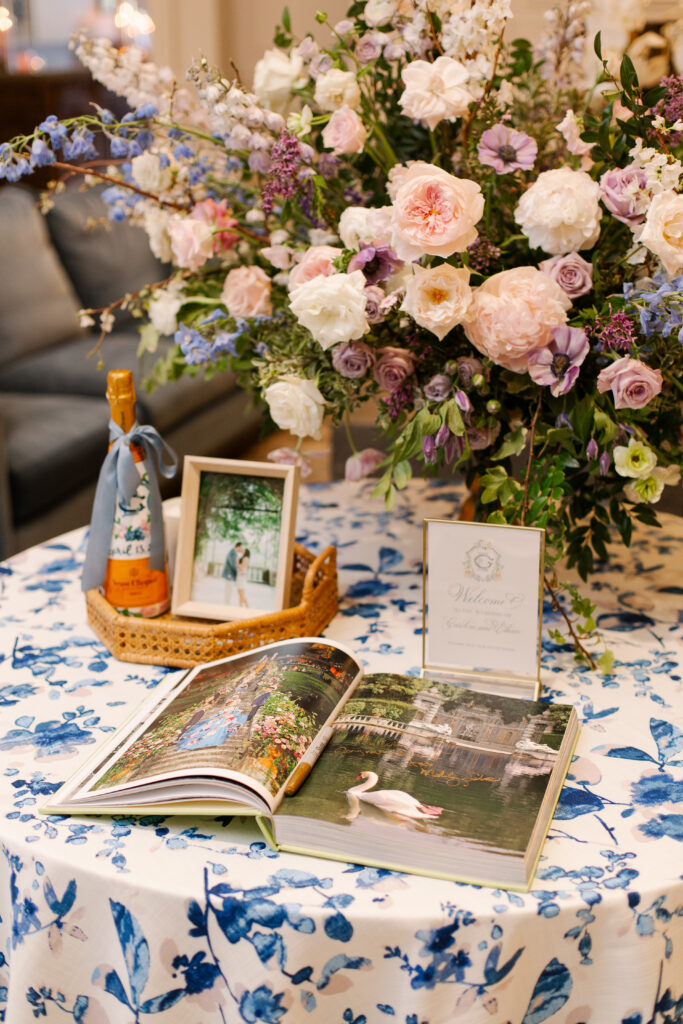 Statement welcome arrangement with lush petal heavy blooms including peonies, roses, ranunculus, and anemones. Garden inspired spring wedding in Nashville, TN. Pastel color palette for spring wedding which shades of pink, purple, lavender, and cream. Design by Rosemary & Finch Floral Design in Nashville, TN. 