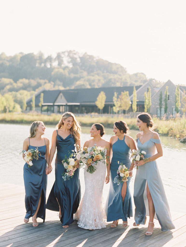 Whimsical bridal bouquet for fall Tennessee wedding. Soft whimsical floral design for unique fall wedding design. Fall wedding color palette in brown, soft blue, dusty rose, and muted greens. Whimsical florals featuring dried hydrangeas, tulips, delphinium, and grasses. Design by Rosemary & Finch Floral Design in Nashville, TN. 