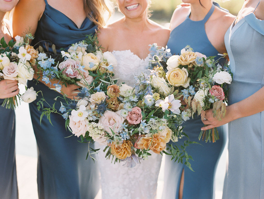 Whimsical bridal bouquet for fall Tennessee wedding. Soft whimsical floral design for unique fall wedding design. Fall wedding color palette in brown, soft blue, dusty rose, and muted greens. Whimsical florals featuring dried hydrangeas, tulips, delphinium, and grasses. Design by Rosemary & Finch Floral Design in Nashville, TN. 