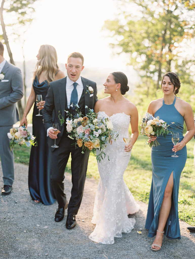 Whimsical bridal bouquet for fall Tennessee wedding. Soft whimsical floral design for unique fall wedding design. Fall wedding color palette in brown, soft blue, dusty rose, and muted greens. Whimsical florals featuring dried hydrangeas, tulips, delphinium, and grasses. Design by Rosemary & Finch Floral Design in Nashville, TN. 