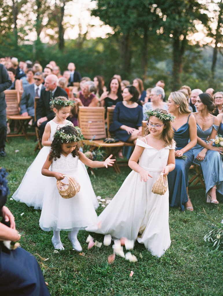 Dainty floral crowns for flower girls. Greenery and floral accents for flower girl crowns. Soft whimsical floral design for unique fall wedding design. Fall wedding color palette in brown, soft blue, dusty rose, and muted greens. Design by Rosemary & Finch Floral Design in Nashville, TN. 