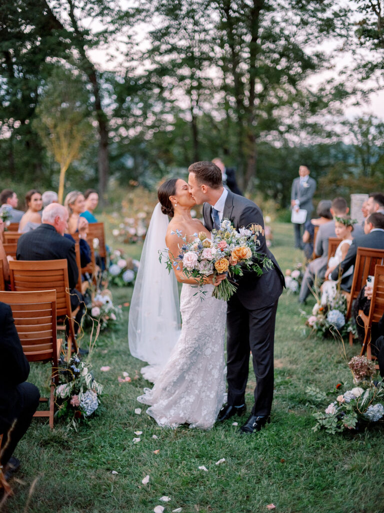 Whimsical bridal bouquet for fall Tennessee wedding. Soft whimsical floral design for unique fall wedding design. Fall wedding color palette in brown, soft blue, dusty rose, and muted greens. Whimsical florals featuring dried hydrangeas, tulips, delphinium, and grasses. Design by Rosemary & Finch Floral Design in Nashville, TN. 