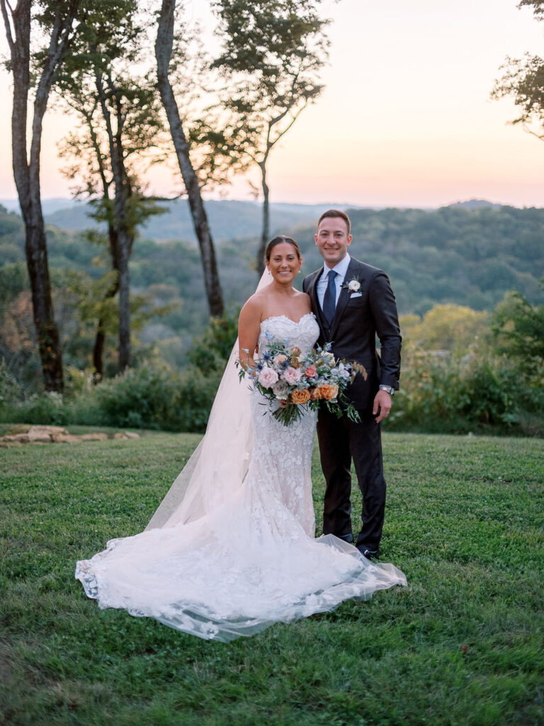 Whimsical bridal bouquet for fall Tennessee wedding. Soft whimsical floral design for unique fall wedding design. Fall wedding color palette in brown, soft blue, dusty rose, and muted greens. Whimsical florals featuring dried hydrangeas, tulips, delphinium, and grasses. Design by Rosemary & Finch Floral Design in Nashville, TN. 