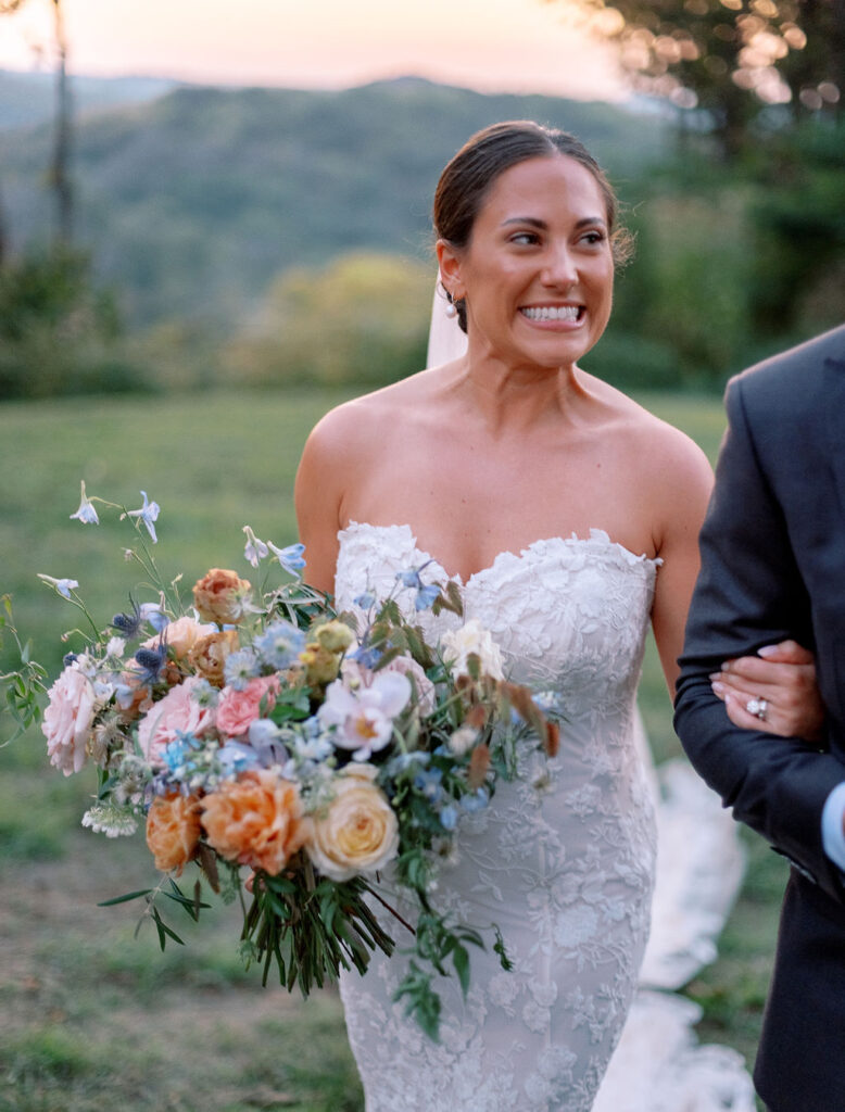 Whimsical bridal bouquet for fall Tennessee wedding. Soft whimsical floral design for unique fall wedding design. Fall wedding color palette in brown, soft blue, dusty rose, and muted greens. Whimsical florals featuring dried hydrangeas, tulips, delphinium, and grasses. Design by Rosemary & Finch Floral Design in Nashville, TN. 