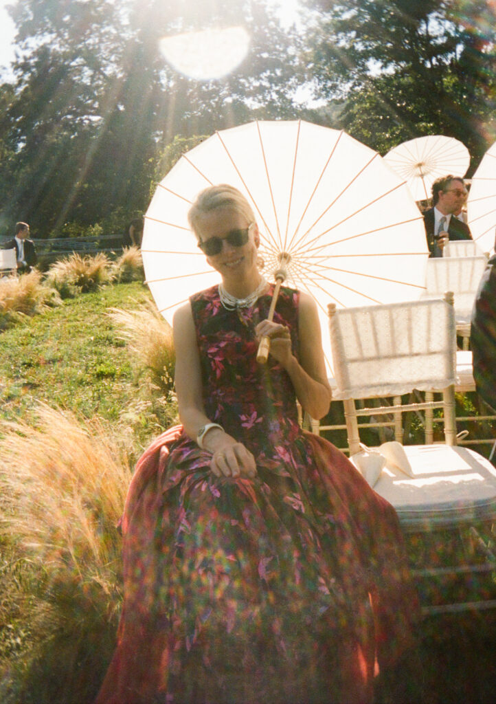 Elegant, organic and untamed outdoor wedding ceremony at Blackberry Farms featured in Vogue. Whimsical, grassy meadows line the aisle and floral accents are highlighted with white cosmos, green mist, solidago, yarrow, scabiosa and grasses. Pergola is covered in lush greenery with soft touches of cream roses and wispy meadows at the base. Design by Rosemary & Finch Floral Design in Nashville, TN. 