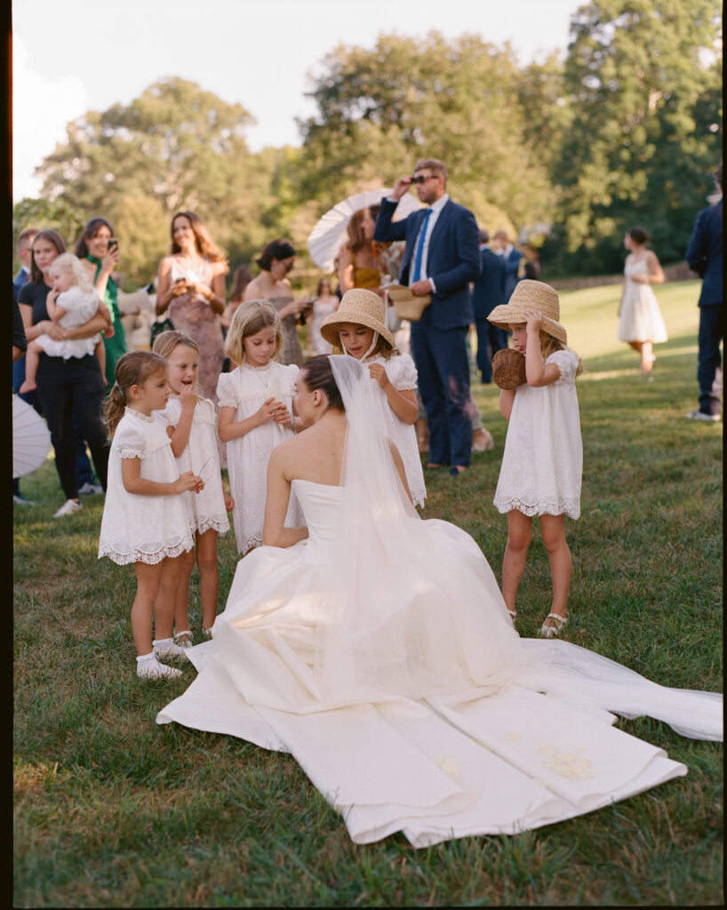 Editorial and timeless bridal bouquet as featured in Vogue. Soft cream hues are highlighted with white peonies, and flowering jasmine for a simple and classic bouquet. Design by Rosemary & Finch Floral Design in Nashville, TN.