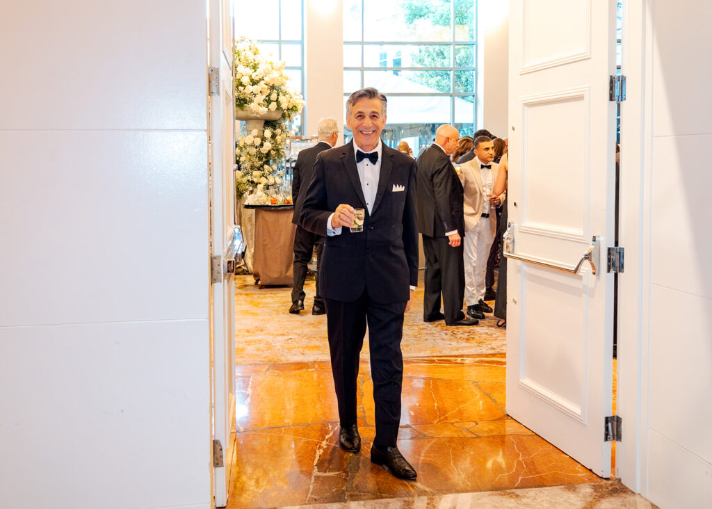 Stunning cocktail hour florals for wedding reception in Buckhead, Atlanta. All-white florals featuring cloud roses, playa blanca roses, peonies, ranunculus, delphinium, baby’s breath, double tulips and lisianthus. Soft and romantic floral display for summer wedding. Design by Rosemary & Finch Floral Design in Nashville, TN.