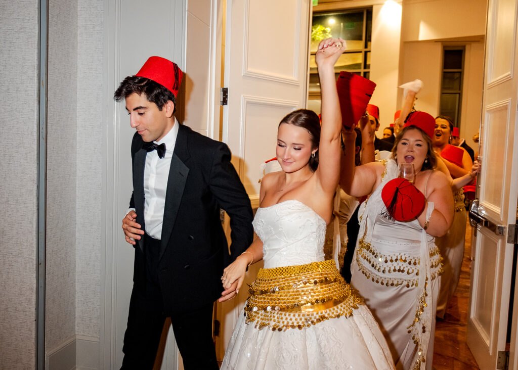 Stunning reception florals for summer wedding reception in Buckhead, Atlanta. All-white floral centerpieces featuring cloud roses, playa blanca roses, peonies, ranunculus, double tulips and lisianthus. Minimal greenery complements beautiful floral table arrangements and bud vases. Elevated all-white rose centerpieces scattered throughout reception. Design by Rosemary & Finch Floral Design in Nashville, TN.