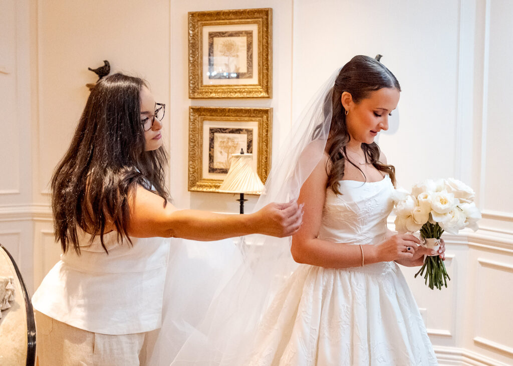 Editorial, modern bridal bouquet with white playa blanca and cloud garden roses and white peonies. Soft, romantic and timeless floral design for Atlanta wedding in Buckhead. Elegant, all-white wedding flowers in a luxury setting. Design by Rosemary & Finch Floral Design in Nashville, TN.