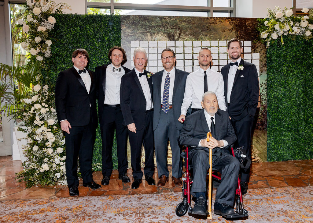 Stunning cocktail hour florals for wedding reception in Buckhead, Atlanta. All-white florals featuring cloud roses, playa blanca roses, peonies, ranunculus, delphinium, baby’s breath, double tulips and lisianthus. Soft and romantic floral display for summer wedding. Design by Rosemary & Finch Floral Design in Nashville, TN.