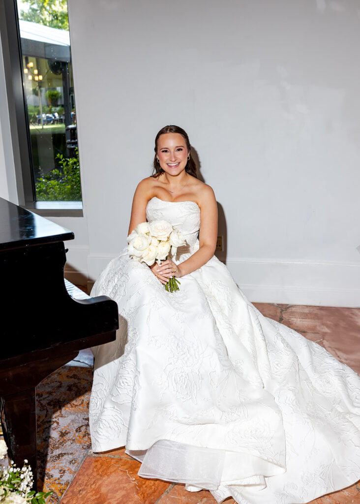 Editorial, modern bridal bouquet with white playa blanca and cloud garden roses and white peonies. Soft, romantic and timeless floral design for Atlanta wedding in Buckhead. Elegant, all-white wedding flowers in a luxury setting. Design by Rosemary & Finch Floral Design in Nashville, TN.