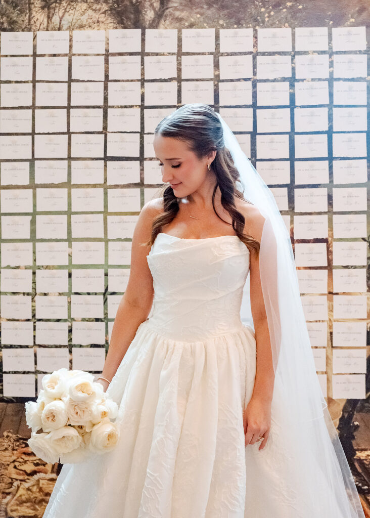 Editorial, modern bridal bouquet with white playa blanca and cloud garden roses and white peonies. Soft, romantic and timeless floral design for Atlanta wedding in Buckhead. Elegant, all-white wedding flowers in a luxury setting. Design by Rosemary & Finch Floral Design in Nashville, TN.