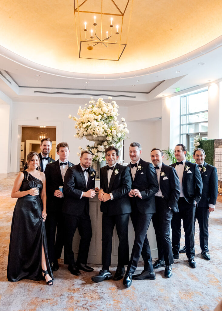 Stunning cocktail hour florals for wedding reception in Buckhead, Atlanta. All-white florals featuring cloud roses, playa blanca roses, peonies, ranunculus, delphinium, baby’s breath, double tulips and lisianthus. Soft and romantic floral display for summer wedding. Design by Rosemary & Finch Floral Design in Nashville, TN.