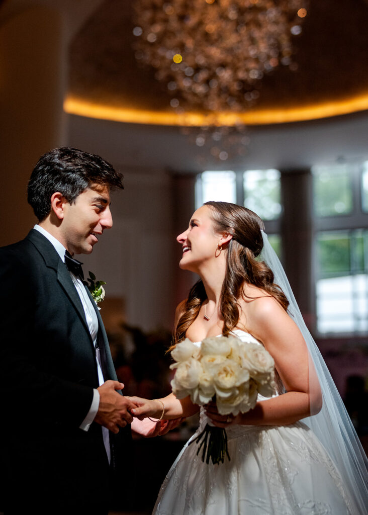 Editorial, modern bridal bouquet with white playa blanca and cloud garden roses and white peonies. Soft, romantic and timeless floral design for Atlanta wedding in Buckhead. Elegant, all-white wedding flowers in a luxury setting. Design by Rosemary & Finch Floral Design in Nashville, TN.