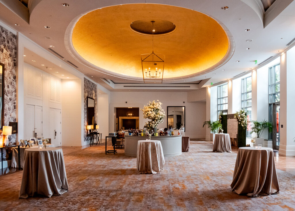 Stunning cocktail hour florals for wedding reception in Buckhead, Atlanta. All-white florals featuring cloud roses, playa blanca roses, peonies, ranunculus, delphinium, baby’s breath, double tulips and lisianthus. Soft and romantic floral display for summer wedding. Design by Rosemary & Finch Floral Design in Nashville, TN.