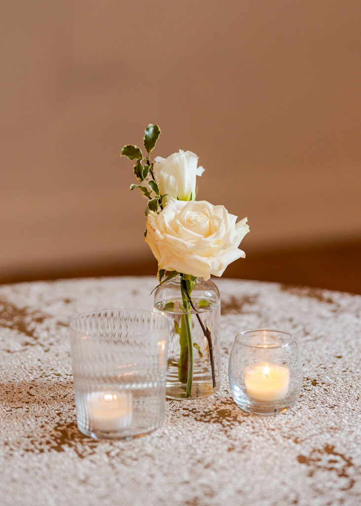 Stunning cocktail hour florals for wedding reception in Buckhead, Atlanta. All-white florals featuring cloud roses, playa blanca roses, peonies, ranunculus, delphinium, baby’s breath, double tulips and lisianthus. Soft and romantic floral display for summer wedding. Design by Rosemary & Finch Floral Design in Nashville, TN.