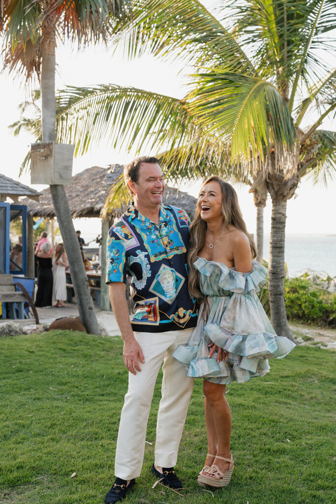 Simple, elegant arrangements for a beachfront wedding welcome party in the Bahamas. Romantic all-white florals create a timeless look highlighted with roses, hydrangeas, tulips, ranunculus, delphinium and greens. Design by Rosemary and Finch Floral Design in Nashville, TN.