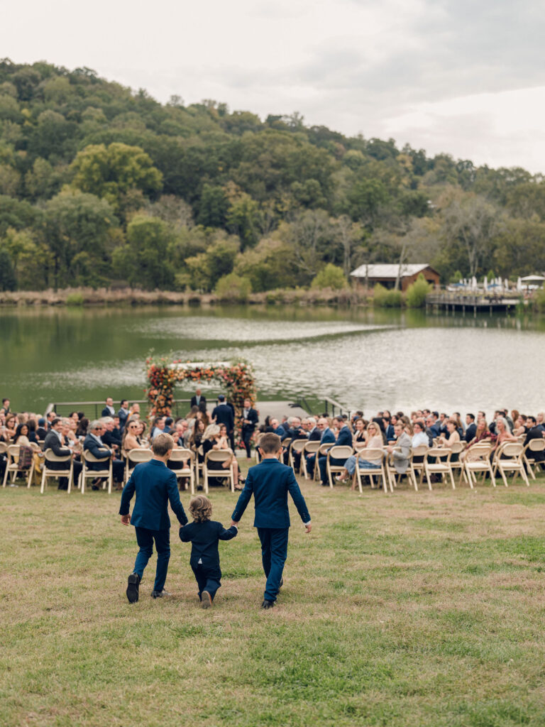 An autumnal, simple bridal bouquet displaying colors of burgundy, blush, rusty orange, and peach. Stunning florals include dahlias, garden roses, moab roses, cappuccino roses, brown ranunculus, zinnias, chocolate cosmos, brown sweet peas, toffee lisianthus, yarrow, marigolds and amaranthus. Beautiful fall florals for a wedding at Southall, TN. Design by Rosemary and Finch Floral Design in Nashville, TN.