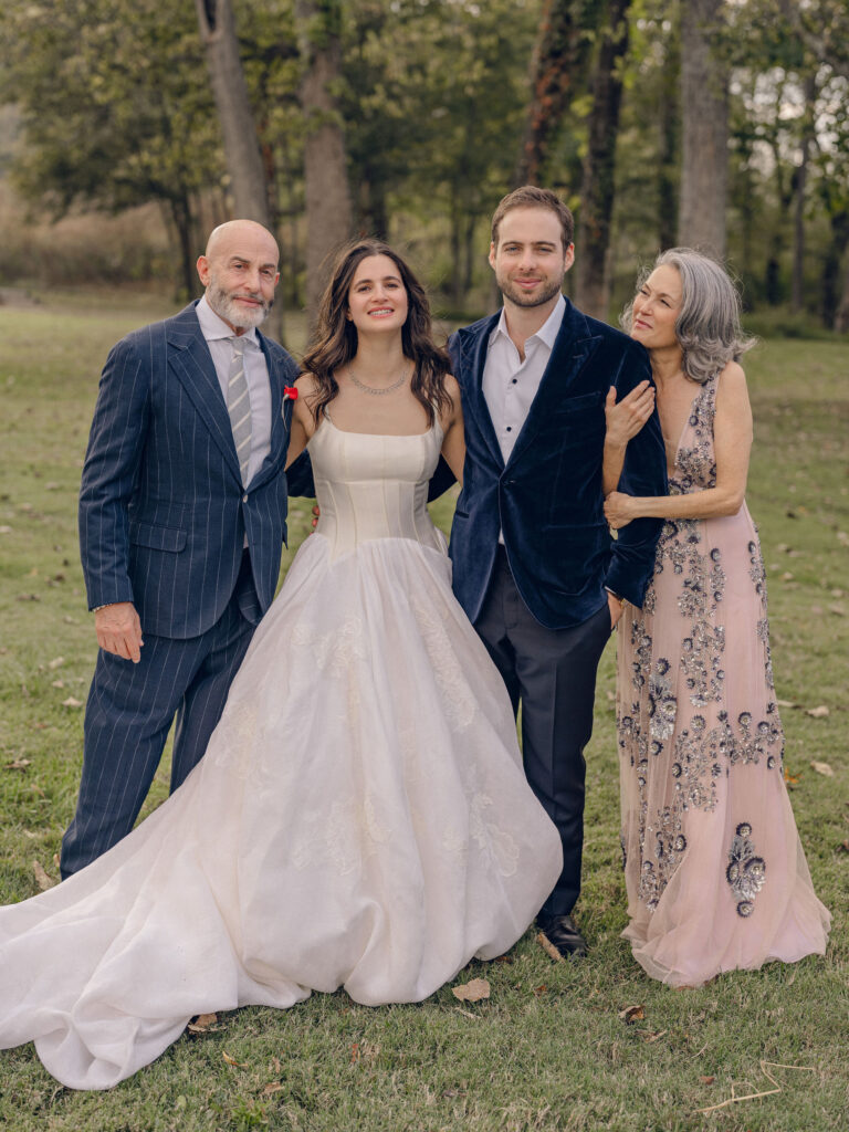 An autumnal, simple bridal bouquet displaying colors of burgundy, blush, rusty orange, and peach. Stunning florals include dahlias, garden roses, moab roses, cappuccino roses, brown ranunculus, zinnias, chocolate cosmos, brown sweet peas, toffee lisianthus, yarrow, marigolds and amaranthus. Beautiful fall florals for a wedding at Southall, TN. Design by Rosemary and Finch Floral Design in Nashville, TN.