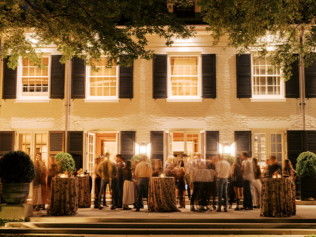 Gorgeous, flower-forward centerpiece arrangements for a private birthday party in Nashville, TN. Autumnal hues of red, brown, orange, pinks and cream are showcased in a stunning display of dahlias, zinnias, ranunculus, nigella, viburnum, rudbeckia, marigolds, liquid amber, spray roses, geranium, rose hips and bittersweet. Fall foliage provides greenery for arrangements and are wrapped around each tent pole and pendant. Design by Rosemary and Finch Floral Design in Nashville, TN. 