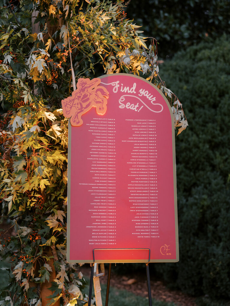 Gorgeous, flower-forward centerpiece arrangements for a private birthday party in Nashville, TN. Autumnal hues of red, brown, orange, pinks and cream are showcased in a stunning display of dahlias, zinnias, ranunculus, nigella, viburnum, rudbeckia, marigolds, liquid amber, spray roses, geranium, rose hips and bittersweet. Fall foliage provides greenery for arrangements and are wrapped around each tent pole and pendant. Design by Rosemary and Finch Floral Design in Nashville, TN. 