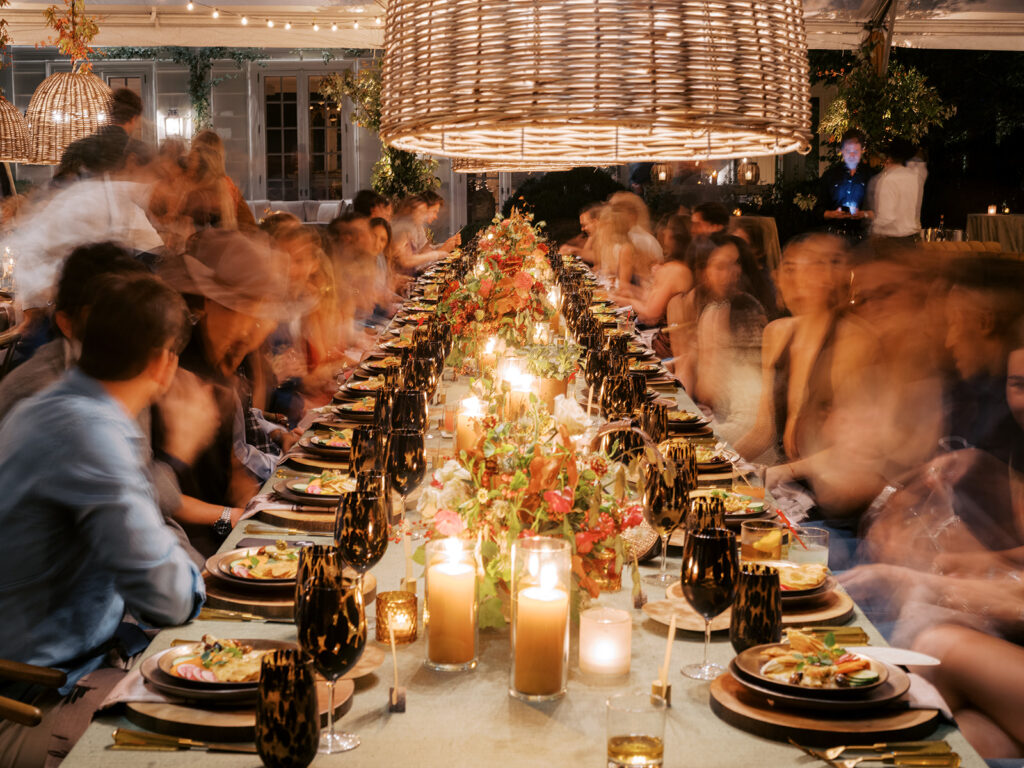 Gorgeous, flower-forward centerpiece arrangements for a private birthday party in Nashville, TN. Autumnal hues of red, brown, orange, pinks and cream are showcased in a stunning display of dahlias, zinnias, ranunculus, nigella, viburnum, rudbeckia, marigolds, liquid amber, spray roses, geranium, rose hips and bittersweet. Fall foliage provides greenery for arrangements and are wrapped around each tent pole and pendant. Design by Rosemary and Finch Floral Design in Nashville, TN. 