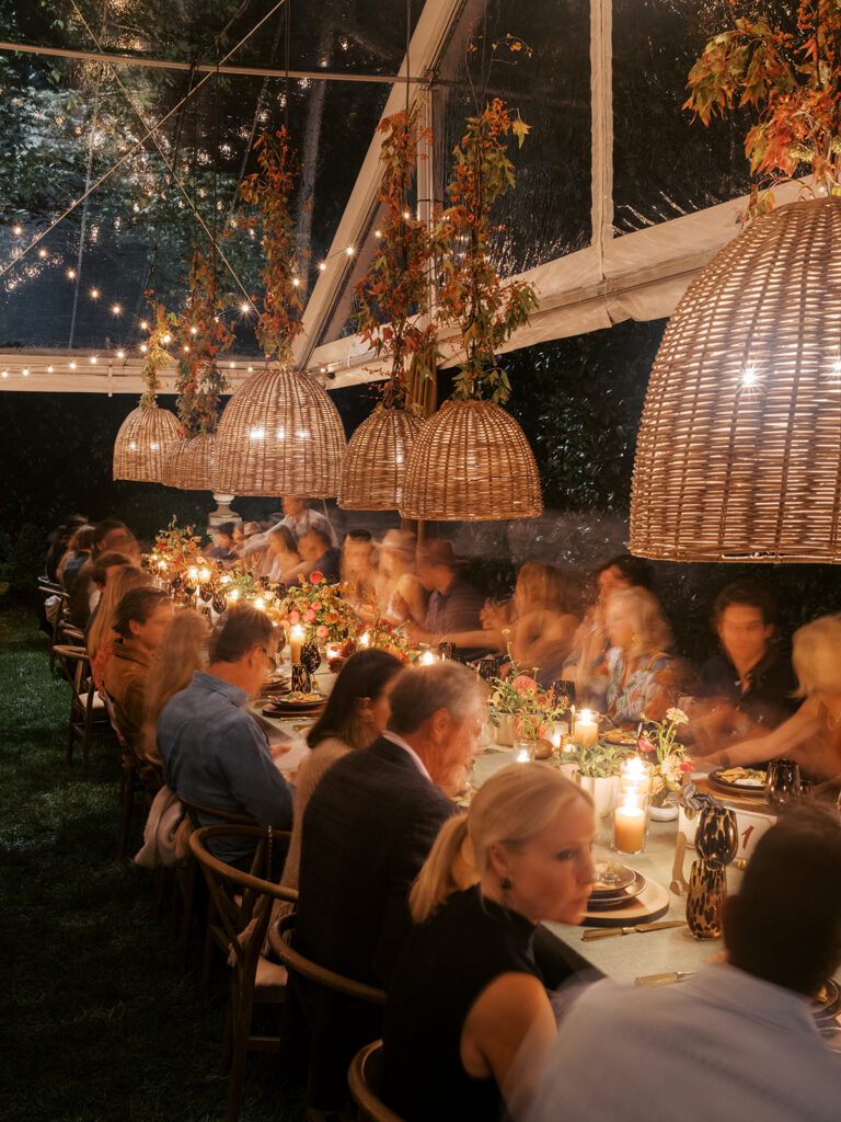 Gorgeous, flower-forward centerpiece arrangements for a private birthday party in Nashville, TN. Autumnal hues of red, brown, orange, pinks and cream are showcased in a stunning display of dahlias, zinnias, ranunculus, nigella, viburnum, rudbeckia, marigolds, liquid amber, spray roses, geranium, rose hips and bittersweet. Fall foliage provides greenery for arrangements and are wrapped around each tent pole and pendant. Design by Rosemary and Finch Floral Design in Nashville, TN. 