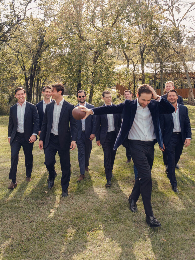 An autumnal, simple bridal bouquet displaying colors of burgundy, blush, rusty orange, and peach. Stunning florals include dahlias, garden roses, moab roses, cappuccino roses, brown ranunculus, zinnias, chocolate cosmos, brown sweet peas, toffee lisianthus, yarrow, marigolds and amaranthus. Beautiful fall florals for a wedding at Southall, TN. Design by Rosemary and Finch Floral Design in Nashville, TN.