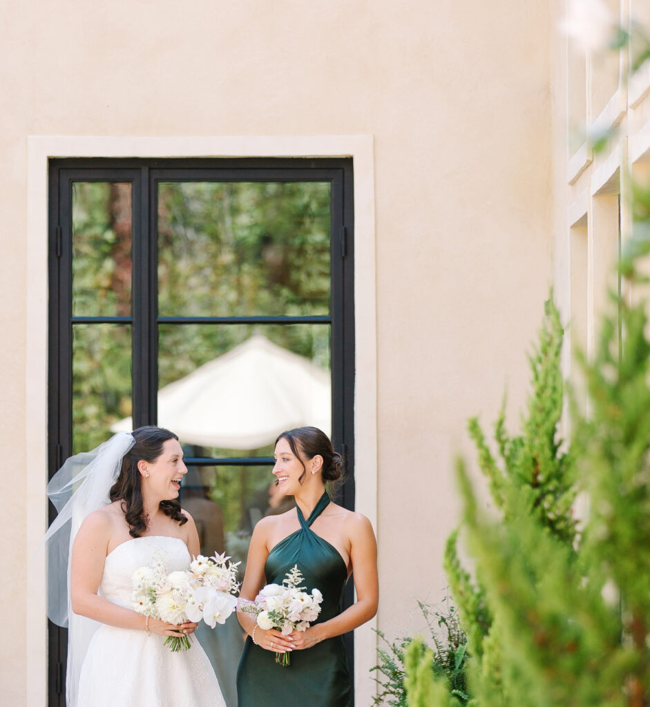 Stunning, elegant flower-forward all-white bridal bouquet with hints of blush and pink for Belle Meade wedding in Nashville. Florals highlighted are phalaenopsis, dahlias, garden roses, majolika roses, ranunculus, butterfly ranunculus, clematis, sweet peas, astilbe, scabiosa and light greenery. The white phalaenopsis creates a soft and bright focal moment for the bouquet. Design by Rosemary and Finch Floral Design in Nashville, TN. 